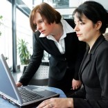 Women looking at a computer in the office