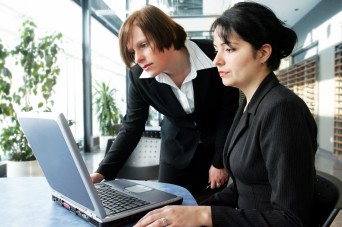 Women looking at a computer in the office
