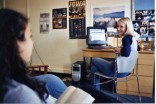Two female college roommates in dorm room