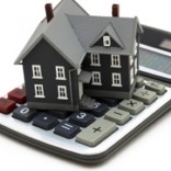 House sitting on calculator