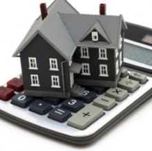 House sitting on calculator
