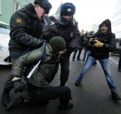 Russian activist detained by police.