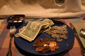Dinner plate with money on it