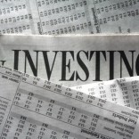 Investing headline in newspaper