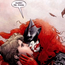 Batwoman kissing her girlfriend