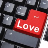 Computer keyboard with love on the enter key