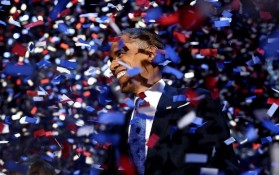 President Barack Obama amidst confetti after giving his victory speech