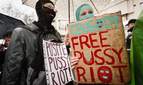 FreePussyRiot Protesters holding multilingual "Free Pussy Riot" signs