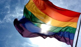 Rainbow flag and blue sky