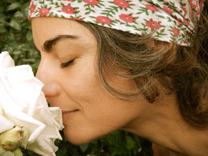 Traci Dinwiddie smelling the flowers in Portland
