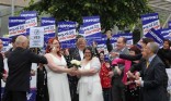 Jaye (left) and Ruth Richard-Hill from Glasgow, in a mock marriage ceremony outside Scottish parliament in Edinburgh (Photo: Andrew Milligan/PA)