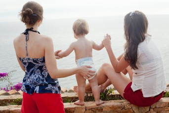 Two women with small child