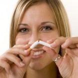 Woman breaking cigarette
