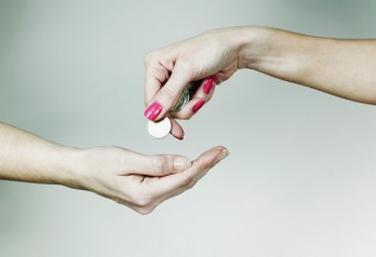 Woman giving other woman change