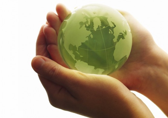 5 (almost) effortless ways to go green Woman holding green globe