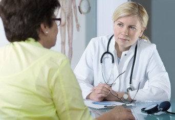 Woman talking to doctor