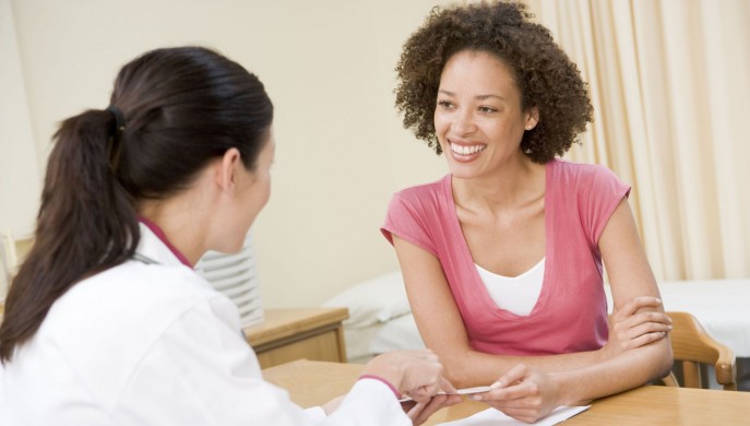 Woman talking to doctor