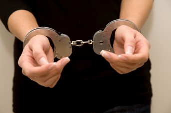 Woman's hands in handcuffs