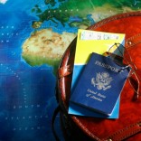 Map with passport and airline tickets