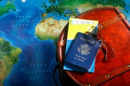 Map with passport and airline tickets
